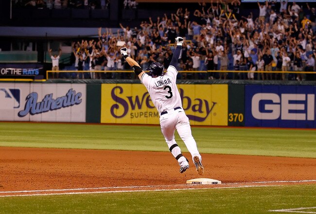 ST PETERSBURG, FL - SEPTEMBER 28:  Infielder Evan Longoria #3 of the Tampa Bay Rays rounds the bases after his bottom of the twelveth inning walk off home run against the New York Yankees during the game at Tropicana Field on September 28, 2011 in St. Petersburg, Florida.  (Photo by J. Meric/Getty Images)