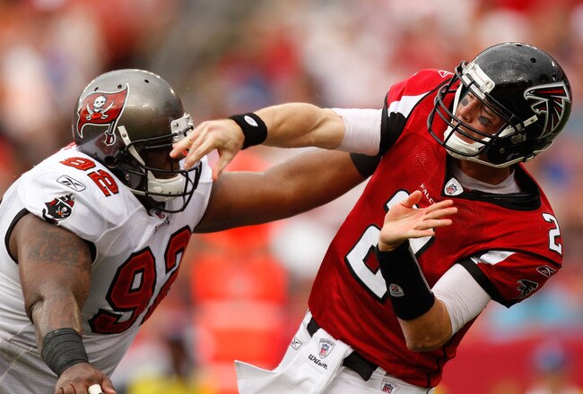 TAMPA, FL - SEPTEMBER 25:  Quarterback Matt Ryan #2 of the Atlanta Falcons is hit by Brian Price #92 of the Tampa Bay Buccaneers at Raymond James Stadium on September 25, 2011 in Tampa, Florida.  (Photo by Mike Ehrmann/Getty Images)