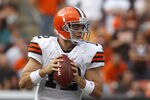 CLEVELAND, OH - SEPTEMBER 25:  Quarterback Colt McCoy #12 of the Cleveland Browns looks for a receiver against the Miami Dolphins at Cleveland Browns Stadium on September 25, 2011 in Cleveland, Ohio.  (Photo by Matt Sullivan/Getty Images)