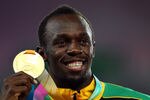DAEGU, SOUTH KOREA - SEPTEMBER 04:  Usain Bolt of Jamaica poses with his gold medal during the medal ceremony for the men's 200 metres final during day nine of 13th IAAF World Athletics Championships at Daegu Stadium on September 4, 2011 in Daegu, South Korea.  (Photo by Mark Dadswell/Getty Images)