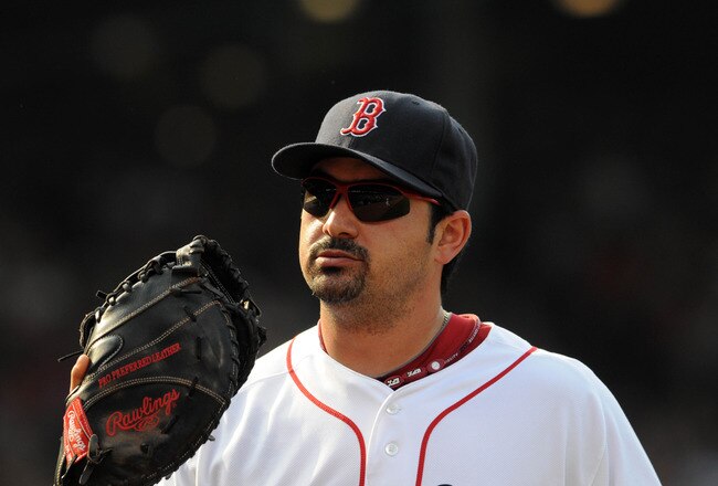 BOSTON, MA - SEPTEMBER 03:  Adrian Gonzalez #28 of the Boston Red Sox jogs off the field in the first inning against the Texas Rangers at Fenway Park on September 3, 2011 in Boston, Massachusetts. The Boston Red Sox won the game 12-7. (Photo by Darren McCollester/Getty Images)