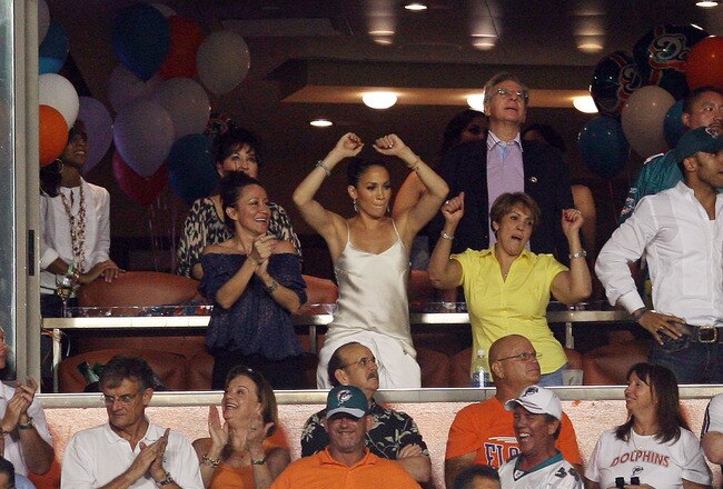 MIAMI - OCTOBER 12:  Performance artist limited partner Jennifer Lopez of the Miami Dolphins celebrates a touchdown against the New York Jets at Land Shark Stadium on October 12, 2009 in Miami, Florida. The Dolphins defeated the Jets 31-27.  (Photo by Doug Benc/Getty Images)