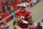 MADISON, WI - SEPTEMBER 24: Russell Wilson #16 of the Wisconsin Badgers looks for a receiver against the South Dakota Coyotes at Camp Randall Stadium on September 24, 2011 in Madison Wisconsin. Wisconsin defeated South Dakota 59-10.(Photo by Jonathan Daniel/Getty Images)