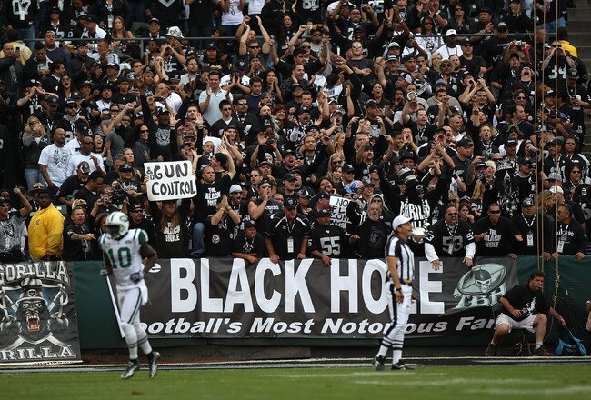 OAKLAND, CA - SEPTEMBER 25:  Fans of the Oakland Raiders cheer against the New York Jets at O.co Coliseum on September 25, 2011 in Oakland, California.  (Photo by Jed Jacobsohn/Getty Images)