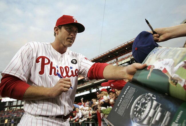 PHILADELPHIA, PA - SEPTEMBER 17: Chase Utley #26 of the Philadelphia Phillies signs autographs before the start of their game against the St. Louis Cardinals on September 17, 2011 at Citizens Bank Park in Philadelphia, Pennsylvania. (Photo by Rich Schultz/Getty Images)