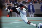 Walter Payton #34 of the Chicago Bears carries the ball