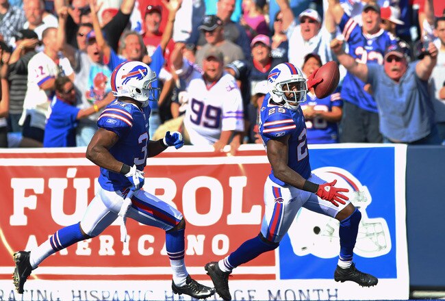 ORCHARD PARK, NY - SEPTEMBER 25: Drayton Florence #29 of the New England Patriots celebrates a touchdown on an interception with Jairus Byrd #31 in NFL game against the Buffalo Bills at Ralph Wilson Stadium on September 25, 2011 in Orchard Park, New York. (Photo by Tom Szczerbowski/Getty Images)