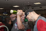 HOUSTON - SEPTEMBER 28:  Matt Holliday , left, of the St. Louis Cardinals pours champagne over Chris Carpenter as they celebrate winning the National League Wildcard at Minute Maid Park on September 28, 2011 in Houston, Texas.  (Photo by Bob Levey/Getty Images)