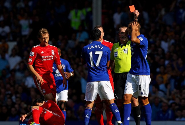LIVERPOOL, ENGLAND - OCTOBER 01:  Jack Rodwell of Everton is shown a red card by Referee Martin Atkinson following a challenge on Luis Suarez of Liverpool during the Barclays Premier League match between Everton and Liverpool at Goodison Park on October 1, 2011 in Liverpool, England.  (Photo by Clive Brunskill/Getty Images)