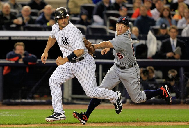 NEW YORK, NY - OCTOBER 01:  Jorge Posada #20 of the New York Yankees is tagged out by Brandon Inge #15 of the Detroit Tigers in the second inning of Game One of the American League Division Series at Yankee Stadium on October 1, 2011 in New York City.  (Photo by Chris Trotman/Getty Images)