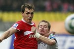 MOSCOW, RUSSIA - OCTOBER 02: Artem Dzyuba (L) of FC Spartak Moscow battles for the ball with Tomas Hubocan of FC Zenit St. Petersburg during the Russian Football League Championship match between FC Spartak Moscow and FC Zenit St. Petersburg at the Luzhniki Stadium on October 02, 2011 in Moscow, Russia.  (Photo by Dmitry Korotayev/Epsilon/Getty Images)