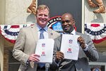 CANTON, OH - AUGUST 5:  NFL Commissioner Roger Goodell (L) and NFLPA Executive Director Demaurice Smith hold up the NFL's new 10-year Collective Bargaining Agreement at the Pro Football Hall of Fame August 5, 2011 in Canton, Ohio.   (Photo by Jason Miller/Getty Images)