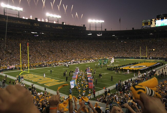 GREEN BAY, WI - SEPTEMBER 08:  Fans cheer during player introductions as the Green Bay Packers take the field  before the NFL opening season game against the New Orleans Saints at Lambeau Field on September 8, 2011 in Green Bay, Wisconsin. The Packers defeated the Saints 42-34.  (Photo by Jonathan Daniel/Getty Images)