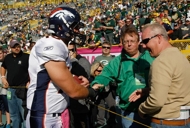 GREEN BAY, WI - OCTOBER 2: Tim Tebow #15 of the Denver Broncos talks with fans prior to the game against the Green Bay Packers at Lambeau Field on October 2, 2011 in Green Bay, Wisconsin. (Photo by Scott Boehm/Getty Images)