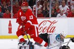 DETROIT - MAY 10: Pavel Datsyuk #13 of the Detroit Red Wings controls the puck in front of Joe Thornton #19 of the San Jose Sharks during the second period in Game Six of the Western Conference Semifinals during the 2011 NHL Stanley Cup Playoffs on May 10, 2011 at Joe Louis Arena in Detroit, Michigan. (Photo by Gregory Shamus/Getty Images)