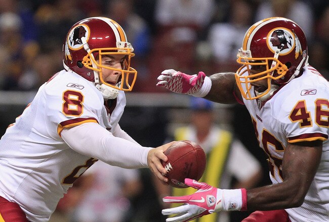 ST. LOUIS, MO - OCTOBER 2:  Rex Grossman #8 makes the handoff to Ryan Torain #46 of the Washington Redskins October 2, 2011 at the Edward Jones Dome in St. Louis, Missouri. The Redskins defeated the Rams 17-10. (Photo by Whitney Curtis/Getty Images)