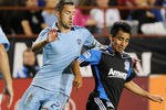 SANTA CLARA, CA - OCTOBER 01: Rafael Baca #30 of the San Jose Earthquakes dribbles the ball away from Davy Arnaud #22 of the Sporting Kansas City during an MLS soccoer game at Buck Shaw Stadium on October 1, 2011 in Santa Clara, California. The game ended in a 1 to 1 tie. (Photo by Thearon W. Henderson/Getty Images)