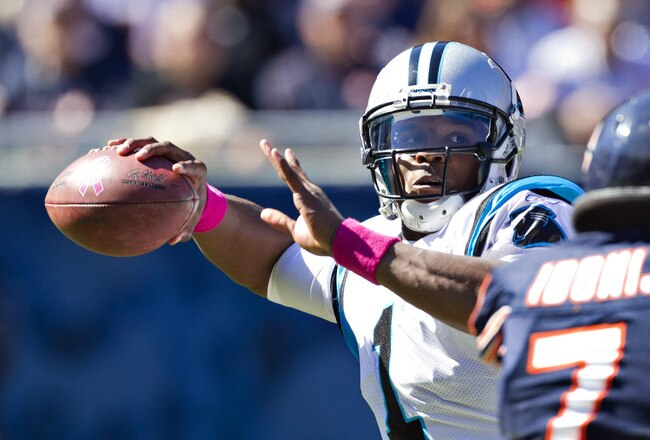CHICAGO, IL - OCTOBER 2:   Cam Newton #1 of the Carolina Panthers throws a pass against the Chicago Bears at the Soldier Field on October 2, 2011 in Chicago, Illinois.  (Photo by Wesley Hitt/Getty Images)