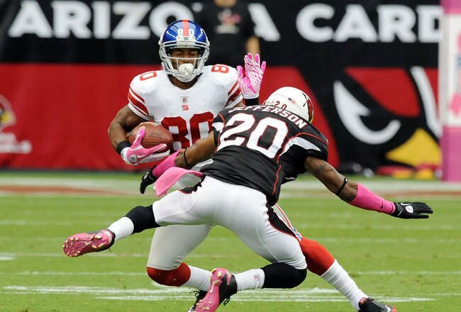 GLENDALE, AZ - OCTOBER 02:  Victor Cruz #80 of the New York Giants makes a move on A.J. Jefferson #20 of the Arizona Cardinals at University of Phoenix Stadium on October 2, 2011 in Glendale, Arizona.  (Photo by Norm Hall/Getty Images)