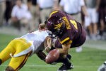 TEMPE, AZ - SEPTEMBER 24:  Aaron Pflugrad #4 of the Arizona State Sun Devils fumbles the ball after getting hit against the University of Southern California Trojans at Sun Devil Stadium on September 24, 2011 in Tempe, Arizona.  (Photo by Norm Hall/Getty Images)