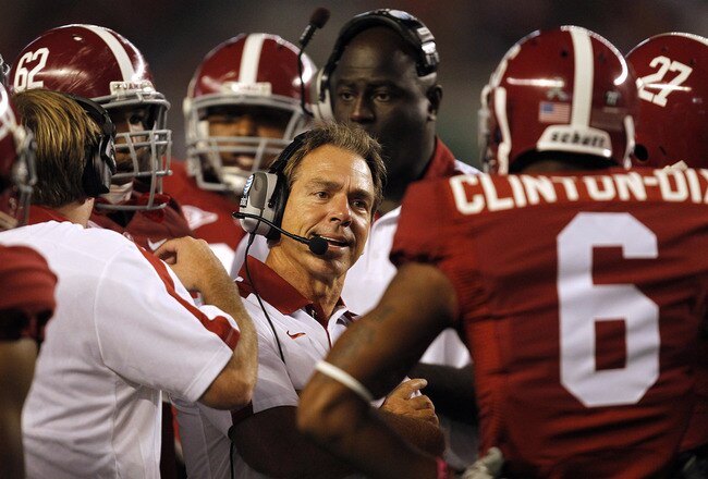 TUSCALOOSA, AL - SEPTEMBER 17:  Coach Nick Saban of the Alabama Crimson Tide talks with defensive players during a timeout in a game against North Texas on September 17, 2011 at Bryant-Denny Stadium in Tuscaloosa, Alabama. (Photo by Butch Dill/Getty Images)