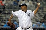 NEW YORK, NY - SEPTEMBER 30:  CC Sabathia #52 of the New York Yankees pitches in the rain against the Detroit Tigers during Game One of the American League Division Series at Yankee Stadium on September 30, 2011 in the Bronx borough of New York City.  (Photo by Chris Trotman/Getty Images)