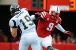 LINCOLN, NE - SEPTEMBER 03: Jason Ankrah #9 of the Nebraska Cornhuskers eyes B.J. Coleman #19 of the Chattanooga Mocs during their game at Memorial Stadium September 3, 2011in Lincoln, Nebraska. Nebraska won 40-7. (Photo by Eric Francis/Getty Images)