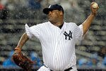 NEW YORK, NY - SEPTEMBER 30:  CC Sabathia #52 of the New York Yankees pitches in the rain against the Detroit Tigers during Game One of the American League Division Series at Yankee Stadium on September 30, 2011 in the Bronx borough of New York City.  (Photo by Chris Trotman/Getty Images)