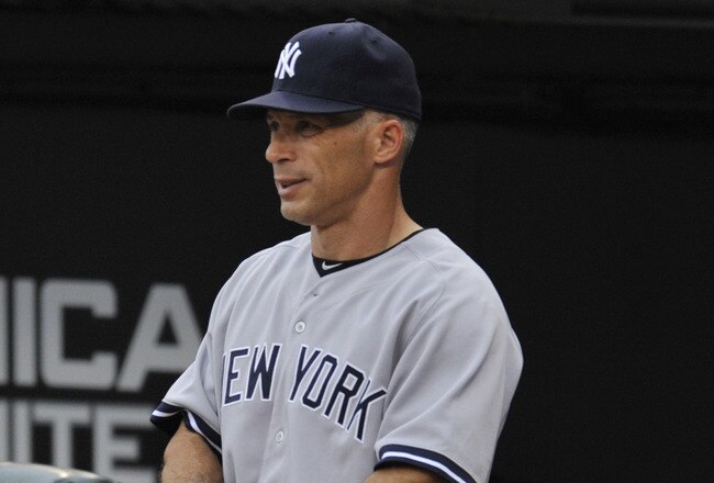 CHICAGO, IL - AUGUST 01: Joe Girardi #28 manager of the New York Yankees stands in the dugout during the game against the Chicago White Sox on August 1, 2011 at U.S. Cellular Field in Chicago, Illinois.  (Photo by David Banks/Getty Images)