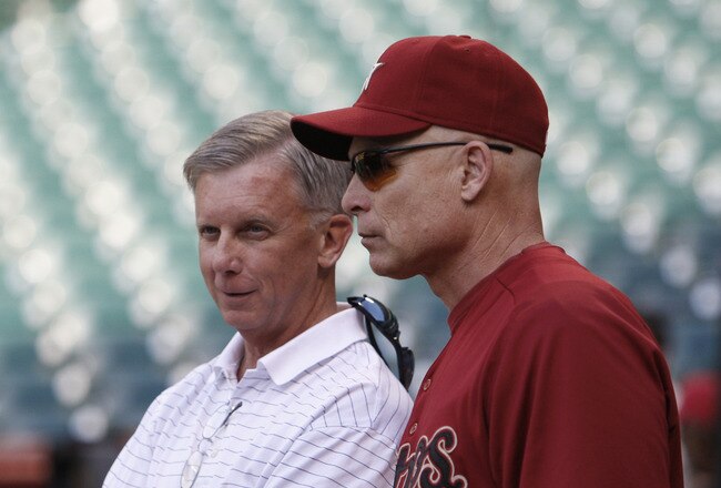 HOUSTON - APRIL 12:  General manager Ed Wade, left, of the Houston Astros and manager Brad Mills talk during batting practice before playing the Chicago Cubs at Minute Maid Park on April 12, 2011 in Houston, Texas. Mills has been suspended for one game and fined an undisclosed amount as a result of his ejection from SundayÕs game vs. Florida.  (Photo by Bob Levey/Getty Images)