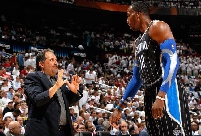 ATLANTA, GA - APRIL 28:  Head coach Stan Van Gundy converses with Dwight Howard #12 of the Orlando Magic during Game Six of the Eastern Conference Quarterfinals in the 2011 NBA Playoffs against the Atlanta Hawks at Philips Arena on April 28, 2011 in Atlanta, Georgia.  NOTE TO USER: User expressly acknowledges and agrees that, by downloading and or using this photograph, User is consenting to the terms and conditions of the Getty Images License Agreement.  (Photo by Kevin C. Cox/Getty Images)