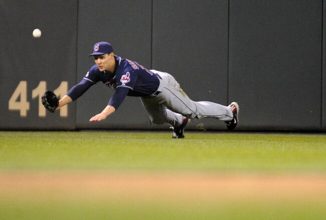 MINNEAPOLIS, MN - SEPTEMBER 16: Grady Sizemore #24 of the Cleveland Indians dives for a ball in center field against the Minnesota Twins in the ninth inning on September 16, 2011 at Target Field in Minneapolis, Minnesota. The Indians defeated the Twins 7-6. (Photo by Hannah Foslien/Getty Images)