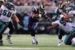 ST. LOUIS, MO - SEPTEMBER 11: Cadillac Williams #33 of the St. Louis Rams runs and pushes off of Cullen Jenkins #97 of the Philadelphia Eagles at the Edward Jones Dome on September 11, 2011 in St. Louis, Missouri. The Eagles defeated the Rams 31-15. (Photo by Jeff Curry/Getty Images)