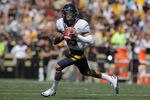 BOULDER, CO - SEPTEMBER 10:  Quarterback Zach Maynard #15 of the California Golden Bears rolls out to pass against the Colorado Buffaloes at Folsom Field on September 10, 2011 in Boulder, Colorado.  (Photo by Doug Pensinger/Getty Images)