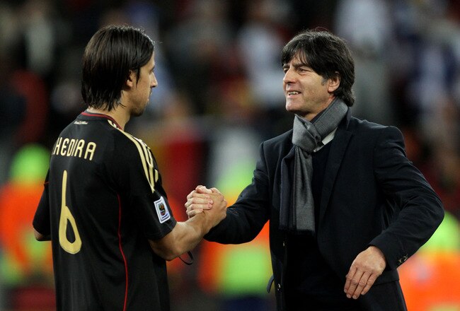 PORT ELIZABETH, SOUTH AFRICA - JULY 10:  Joachim Loew head coach of Germany celebrates victory and third place with Sami Khedira following the 2010 FIFA World Cup South Africa Third Place Play-off match between Uruguay and Germany at The Nelson Mandela Bay Stadium on July 10, 2010 in Port Elizabeth, South Africa.  (Photo by Joern Pollex/Getty Images)