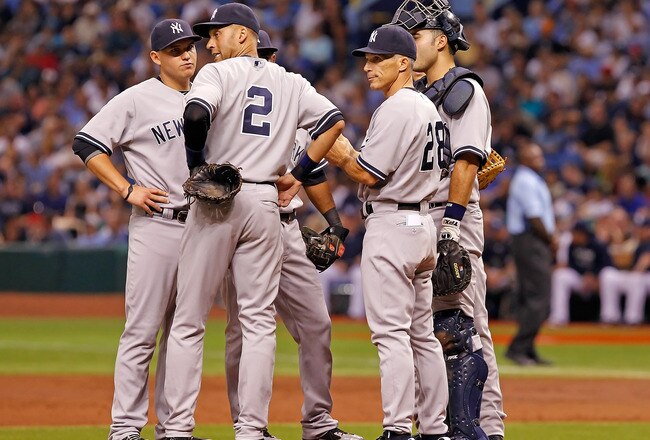 ST. PETERSBURG, FL - SEPTEMBER 28:  Manager Joe Girardi #28 of the New York Yankees makes a pitching change against the Tampa Bay Rays during the game at Tropicana Field on September 28, 2011 in St. Petersburg, Florida.  (Photo by J. Meric/Getty Images)
