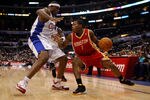 LOS ANGELES, CA - DECEMBER 02:  Kyle Lowry #7 of the Houston Rockets is defended by Al Thornton #12 of the Los Angeles Clippers in the first half at Staples Center on December 2, 2009 in Los Angeles, California. NOTE TO USER: User expressly acknowledges and agrees that, by downloading and/or using this Photograph, user is consenting to the terms and conditions of the Getty Images License Agreement.  (Photo by Jeff Gross/Getty Images)