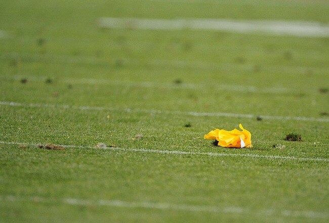 DENVER, CO - SEPTEMBER 12:  A penalty flag lies on the turf during the game between the Oakland Raiders and the Denver Broncos at Sports Authority Field at Mile High on September 12, 2011 in Denver, Colorado.  (Photo by Garrett W. Ellwood/Getty Images)