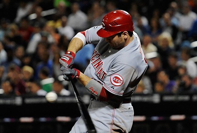 NEW YORK, NY - SEPTEMBER 27:  Joey Votto #19 of the Cincinnati Reds bats against the New York Mets in the third inning of a game at Citi Field on September 27, 2011 in the Flushing neighborhood of the Queens borough of New York City.  (Photo by Patrick McDermott/Getty Images)