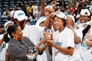 ATLANTA, GA - OCTOBER 07:  WNBA President Laurel Richie presents the MVP Trophy to Seimone Augustus #33 of the Minnesota Lynx against the Atlanta Dream in Game Three of the 2011 WNBA Finals at Philips Arena on October 7, 2011 in Atlanta, Georgia.  NOTE TO USER: User expressly acknowledges and agrees that, by downloading and or using this Photograph, user is consenting to the terms and conditions of the Getty Images License Agreement.  (Photo by Kevin C. Cox/Getty Images)