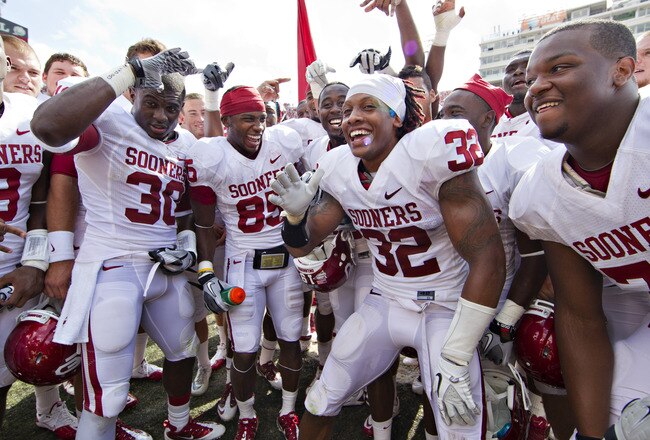 DALLAS, TX - OCTOBER 8:   Players of the Oklahoma Sooners after a win over the Texas Longhorns at the Cotton Bowl on October 8, 2011 in Dallas, Texas.  The Sooners defeated the Longhorns 55 to 17.  (Photo by Wesley Hitt/Getty Images)