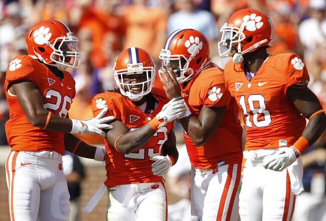 CLEMSON, SC - OCTOBER 8: Tajh Boyd #10 of the Clemson Tigers celebrates with several teammates after rushing for a 14-yard touchdown in the first quarter against the Boston College Eagles at Memorial Stadium on October 8, 2011 in Clemson, South Carolina. (Photo by Joe Robbins/Getty Images)