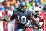 SEATTLE, WA - SEPTEMBER 25:  Wide receiver Sidney Rice #18 of the Seattle Seahawks runs a pass route against A.J. Jefferson #20 the Arizona Cardinals at CenturyLink Field on September 25, 2011 in Seattle, Washington. (Photo by Otto Greule Jr/Getty Images)