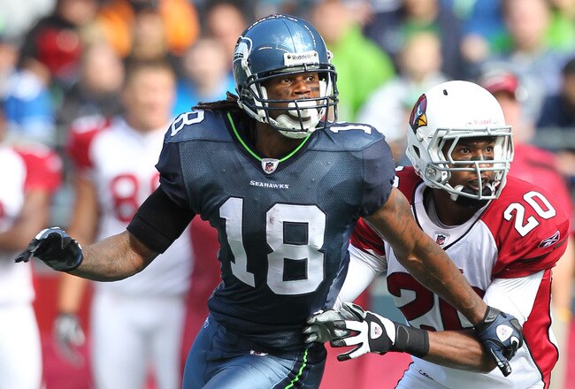 SEATTLE, WA - SEPTEMBER 25:  Wide receiver Sidney Rice #18 of the Seattle Seahawks runs a pass route against A.J. Jefferson #20 the Arizona Cardinals at CenturyLink Field on September 25, 2011 in Seattle, Washington. (Photo by Otto Greule Jr/Getty Images)