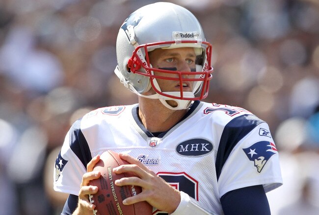 OAKLAND, CA - OCTOBER 02:  Tom Brady #12 of the New England Patriots in action against the Oakland Raiders at O.co Coliseum on October 2, 2011 in Oakland, California.  (Photo by Ezra Shaw/Getty Images)
