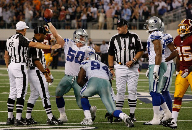 ARLINGTON, TX - SEPTEMBER 26:   Sean Lee #50 of the Dallas Cowboys celebrates after recovering a fumble by Rex Grossman #8 of the Washington Redskins in the fourth quarter during their game at Cowboys Stadium on September 26, 2011 in Arlington, Texas. (Photo by Tom Pennington/Getty Images)