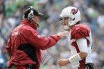 SEATTLE, WA - SEPTEMBER 25:  Kevin Kolb #4 of the Arizona Cardinals talks to head coach Ken Whisenhunt during a timeout in the game against the Seattle Seahawks during the second quarter at CenturyLink Field on September 25, 2011 in Seattle, Washington.  (Photo by Harry How/Getty Images)