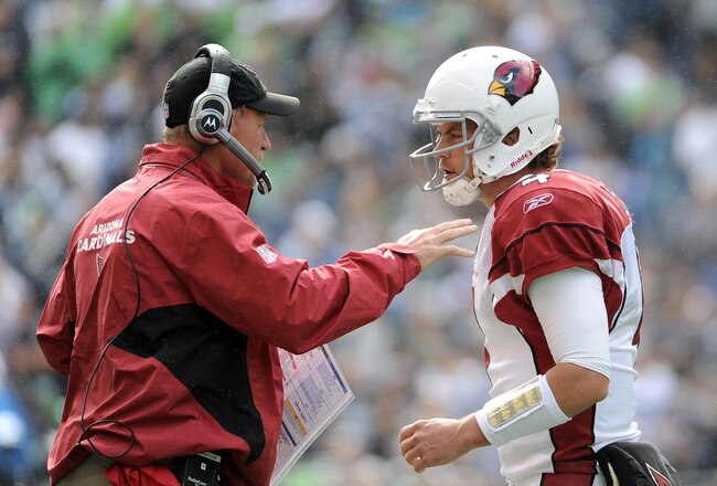 SEATTLE, WA - SEPTEMBER 25:  Kevin Kolb #4 of the Arizona Cardinals talks to head coach Ken Whisenhunt during a timeout in the game against the Seattle Seahawks during the second quarter at CenturyLink Field on September 25, 2011 in Seattle, Washington.  (Photo by Harry How/Getty Images)