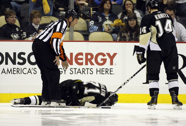 PITTSBURGH, PA - FEBRUARY 04:  Evgeni Malkin #71 of the Pittsburgh Penguins lies injured on the ice during the game against the Buffalo Sabres at Consol Energy Center on February 4, 2011 in Pittsburgh, Pennsylvania.  The Penguins defeated Buffalo 3-2.  (Photo by Justin K. Aller/Getty Images)