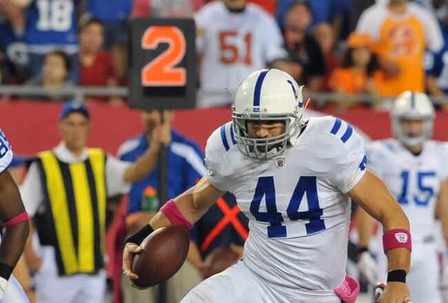 TAMPA, FL - OCTOBER 3:  Tight end Dallas Clark #44 of  the Indianapolis Colts runs upfield with a pass against the Tampa Bay Buccaneers October 3, 2011 at Raymond James Stadium in Tampa, Florida. (Photo by Al Messerschmidt/Getty Images)